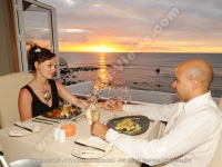 le_recif_hotel_mauritius_hotel_couple_having_diner_at_the_main_restaurant_with_sunset_view.jpg