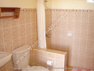 apartment abel mauritius bathroom view
Abel Apartment bathroom. The bathroom is tiled in peach tiles. There is a shower cubicle, a white WC and basin. 
Keywords: Abel Apartment, bathroom, peach, tiled, shower, WC, basin