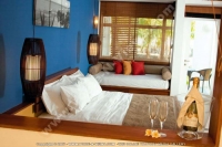 laguna_beach_hotel_and_spa_mauritius_double_bedroom_set_up_with_champagne_for_arrival.jpg