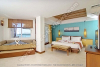 laguna_beach_hotel_and_spa_mauritius_double_bedroom_with_sitting_area.jpg