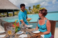 laguna_beach_hotel_and_spa_mauritius_friendly_waiter_at_the_restaurant.jpg