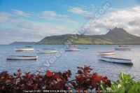 laguna_beach_hotel_and_spa_mauritius_sea_mountain_and_pirogue.jpg