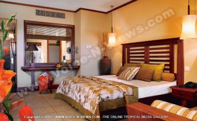 4 star heritage awali golf & spa resort deluxe 2
The Hotel deluxe bedroom. The 160 trendy rooms are arranged along the beach front. Warm colours and precious materials contribute to a tropical atmosphere. Has a double bed, a relaxing chair, a telephone for guests. The bedroom leads onto the bathroom. There is an arrangement of flowers in the bedroom.
Keywords: 4*hotel, deluxe, bedroom, double bed, bedside table, telephone, chair, bathroom