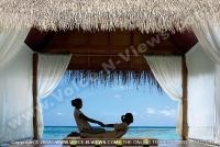 kanuhura_resort_maldives_lady_in_massage_room_and_sea_view.jpg