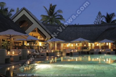 royal palm hotel mauritius common area and swimming pool view at night
