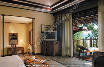 sainte anne resort seychelles villa royale bedroom and balcony view
