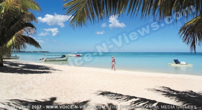trou aux biches resort & spa mauritius lady walking on the beach
