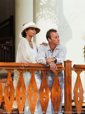 the residence hotel mauritius couple on balcony
